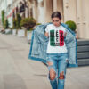 Attractive girl in a jeans jacket and white t-shirt walking along the street. Mock-up. FIESTAS PATRIAS