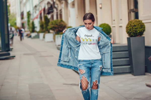 Attractive girl in a jeans jacket and white t-shirt walking along the street. Mock-up. FIESTAS PATRIAS