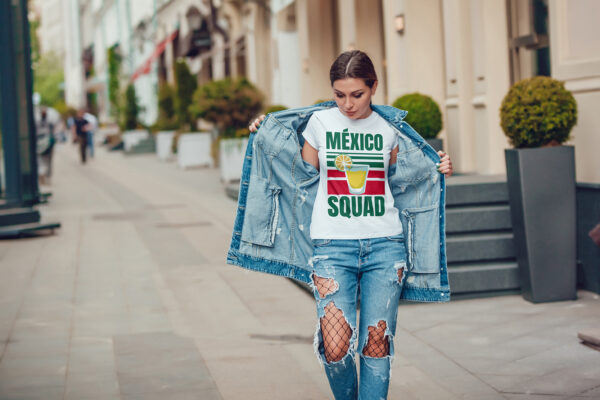 Attractive girl in a jeans jacket and white t-shirt walking along the street. Mock-up. FIESTAS PATRIAS