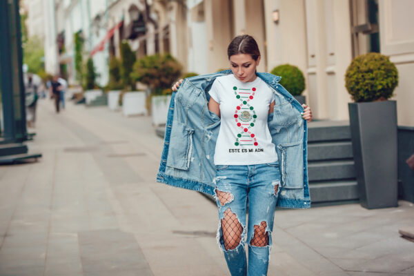 Attractive girl in a jeans jacket and white t-shirt walking along the street. Mock-up. FIESTAS PATRIAS