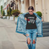 Attractive girl in a jeans jacket and white t-shirt walking along the street. Mock-up. FIESTAS PATRIAS