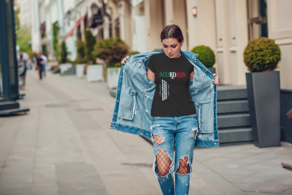 Attractive girl in a jeans jacket and white t-shirt walking along the street. Mock-up. FIESTAS PATRIAS