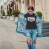Attractive girl in a jeans jacket and white t-shirt walking along the street. Mock-up. FIESTAS PATRIAS