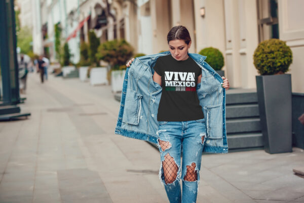 Attractive girl in a jeans jacket and white t-shirt walking along the street. Mock-up. FIESTAS PATRIAS