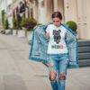 Attractive girl in a jeans jacket and white t-shirt walking along the street. Mock-up. FIESTAS PATRIAS
